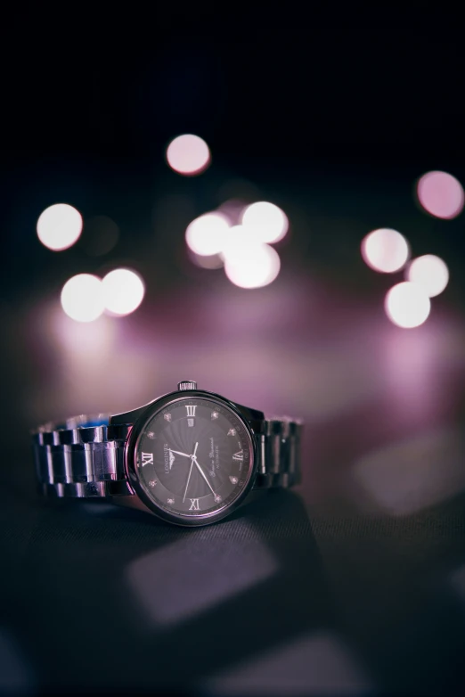 the watch has a dark background with bright bokets