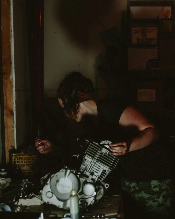 a person in black shirt sitting in a room