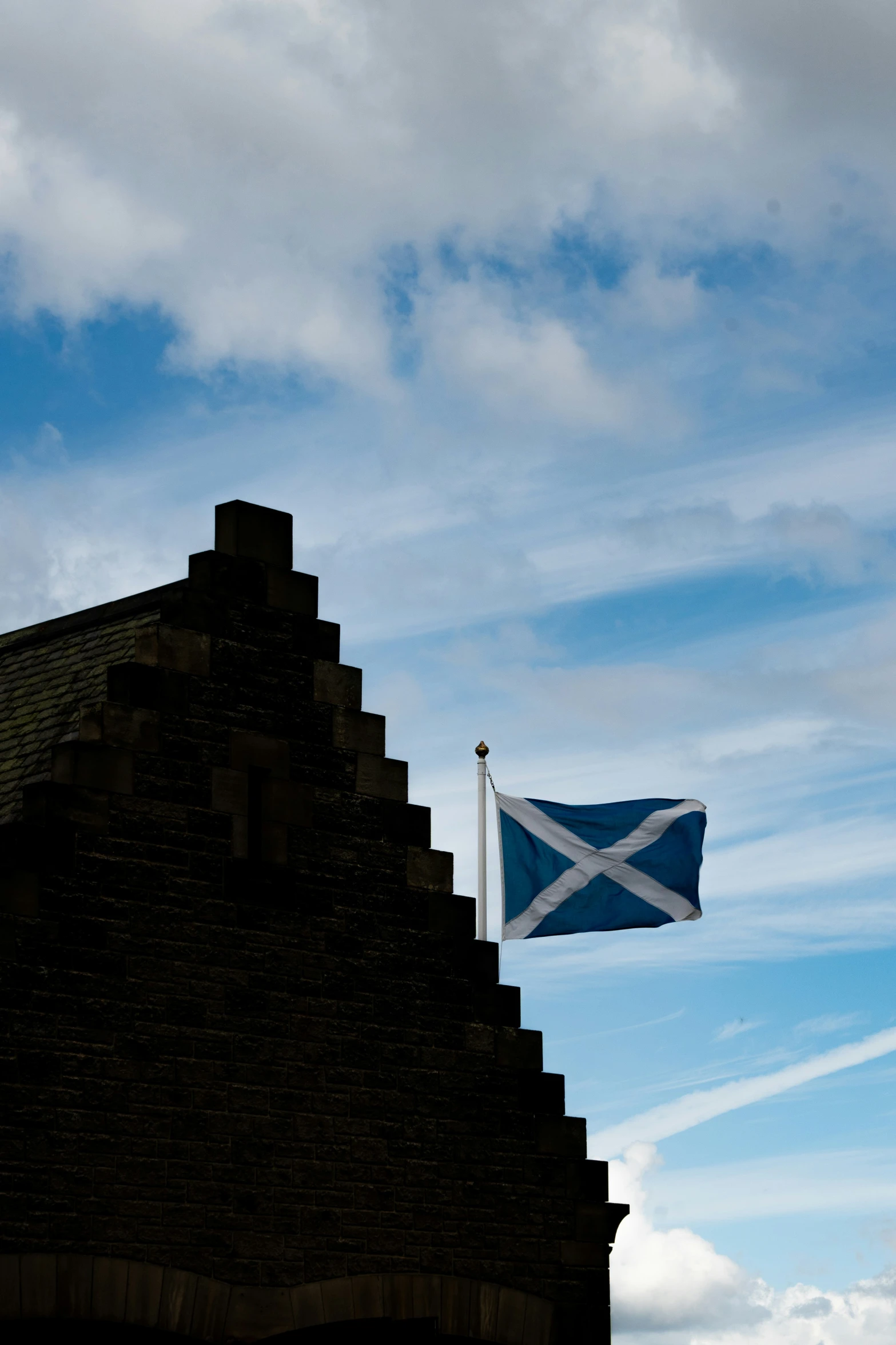 a flag flies high on top of some buildings