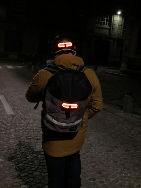 man with headlamps on walking in the dark