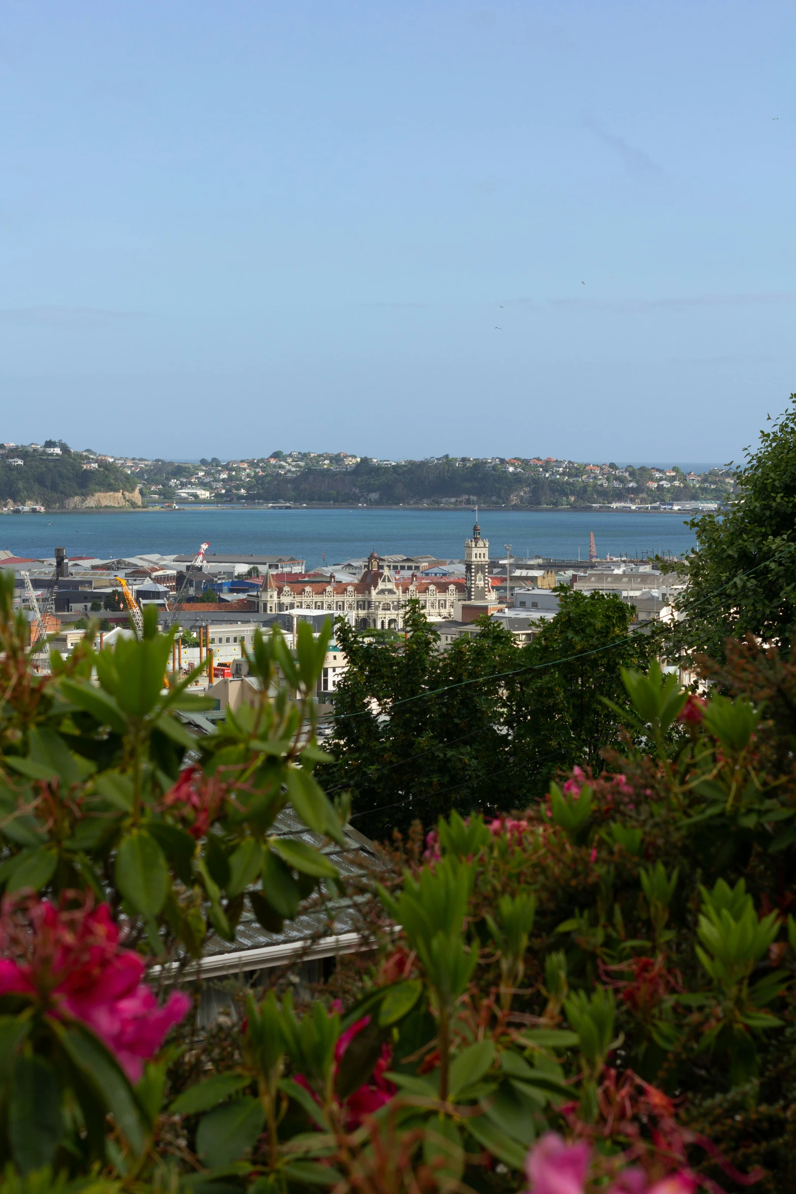 a view of an ocean with many buildings in the distance