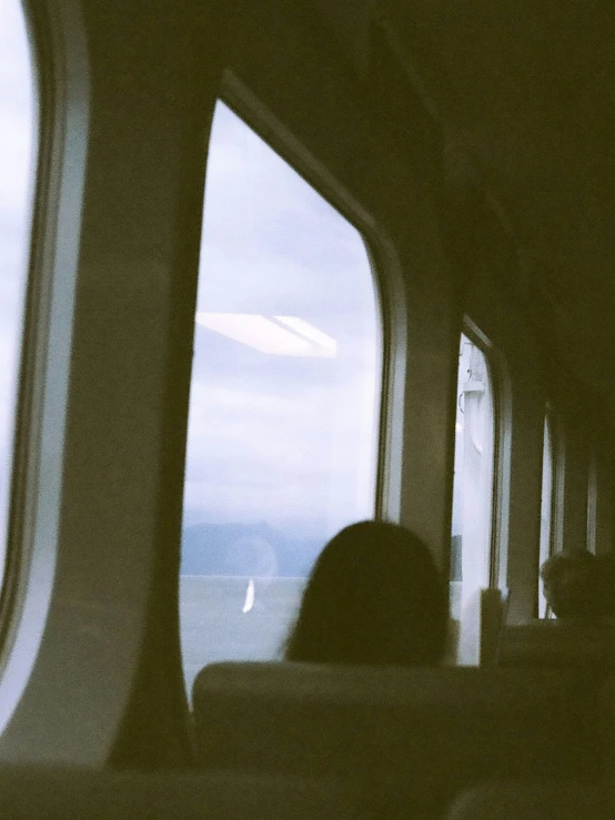 silhouette of people and buildings through open windows