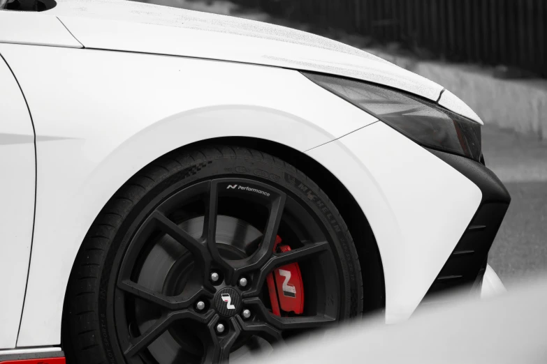 the wheel rims on a car are black and red