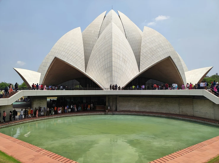 the lotus temple at the entrance to a pond