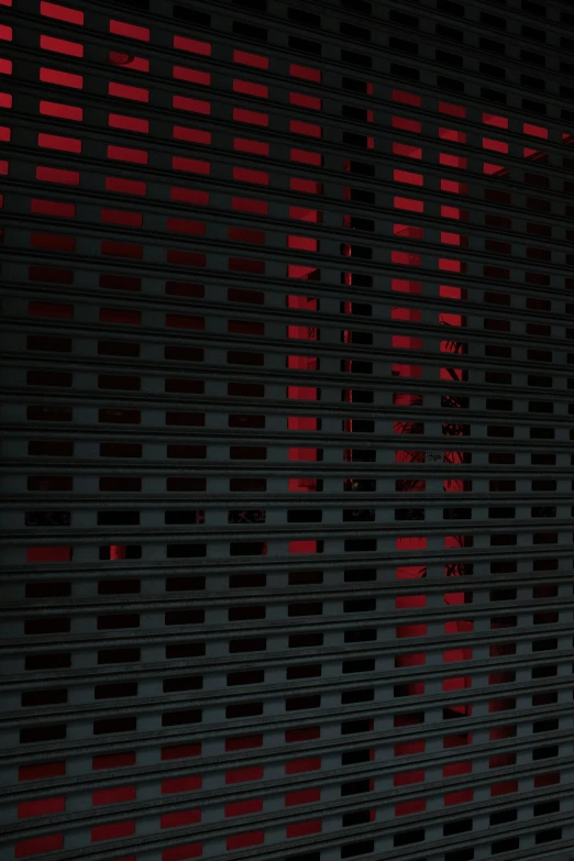 a close up of the side of a building with a red light