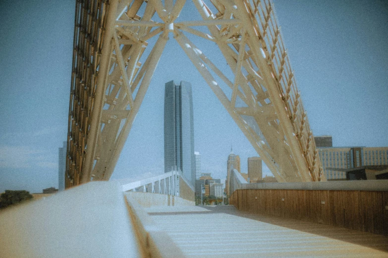 the underside of a building, looking down a walkway