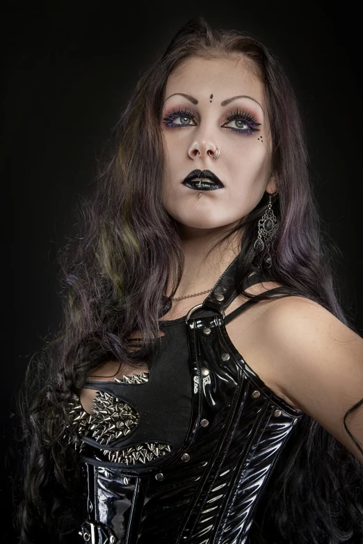 the woman is dressed in costume with black makeup