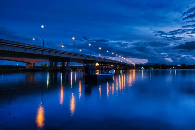 a boat sits at a dock in the dark