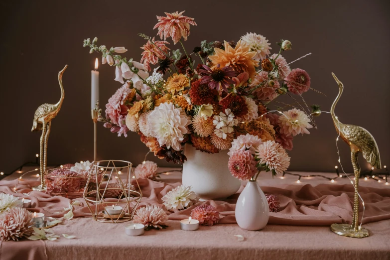 the table is filled with many different types of flowers