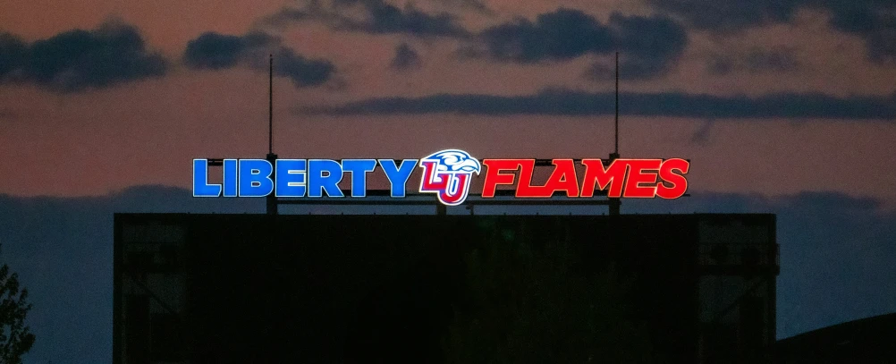 a large sign with a sky in the background