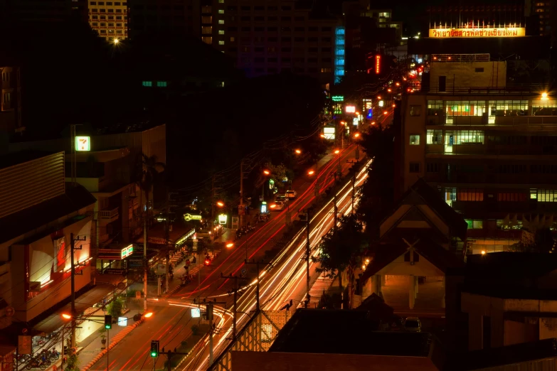 the city at night with traffic, lights and buildings