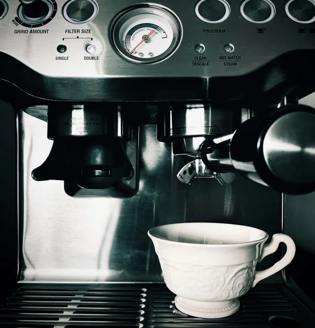 a coffee pot sitting on top of a saucer