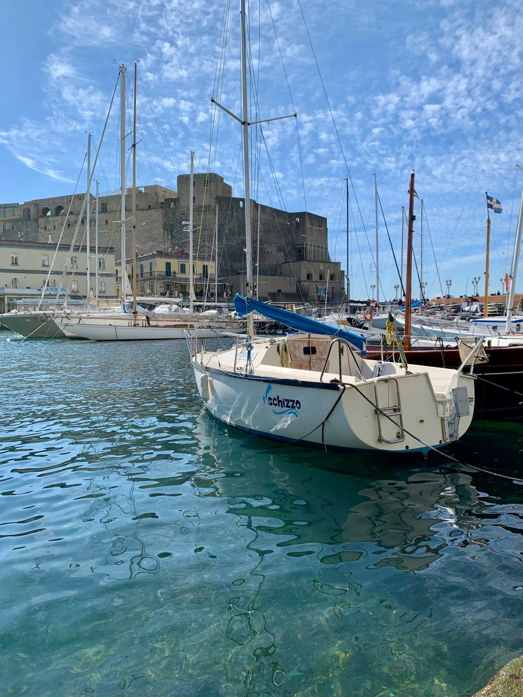 a number of sail boats in a body of water