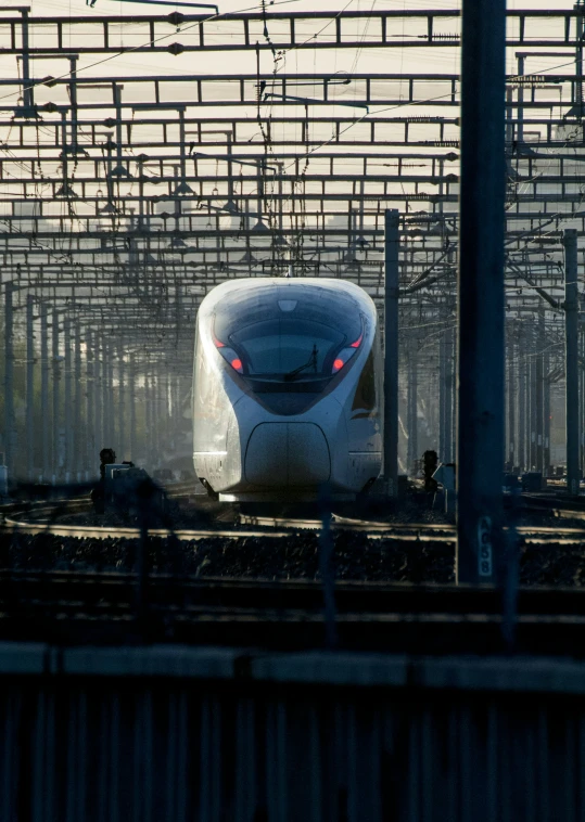 a futuristic train that is in an empty station