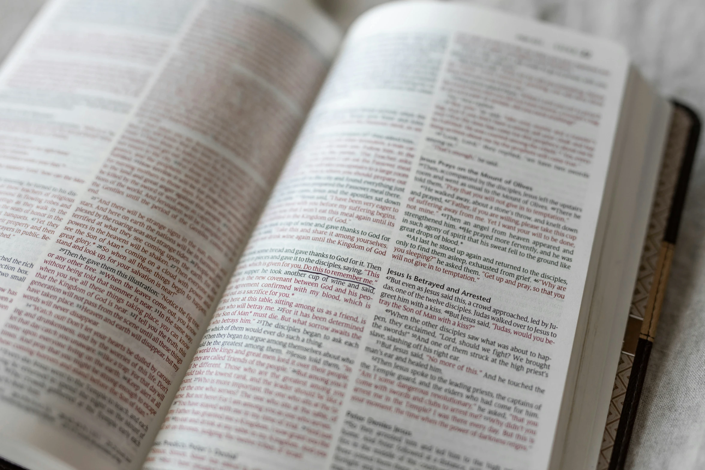 an open bible with a bookmark and a key