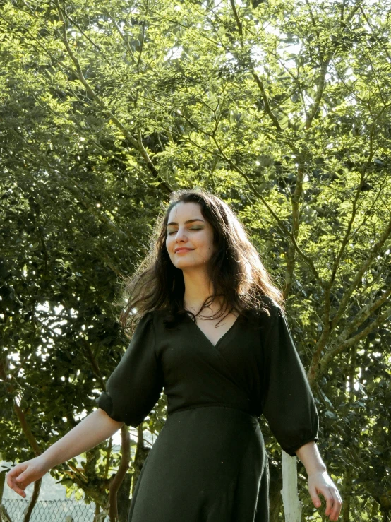 a woman holding an umbrella over her head