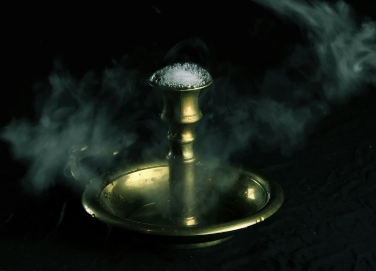 a steam lamp surrounded by smoke on a black background