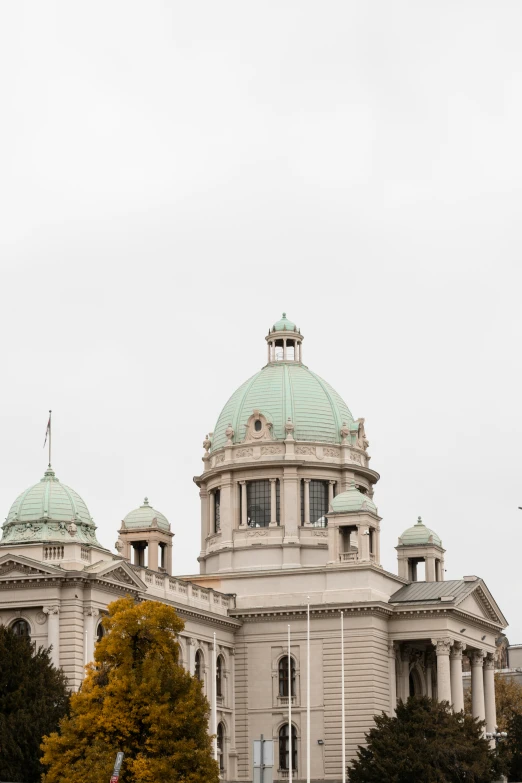 an ornate building stands under a cloudy sky