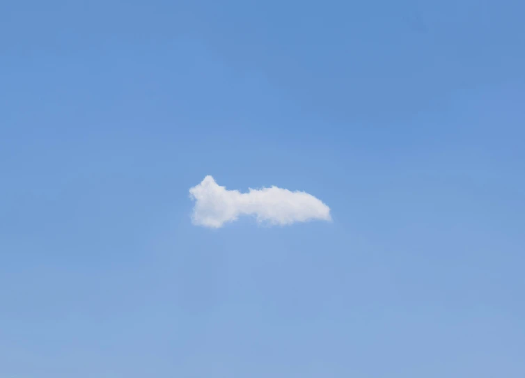 a cloud shaped like the letter i flying high in the sky