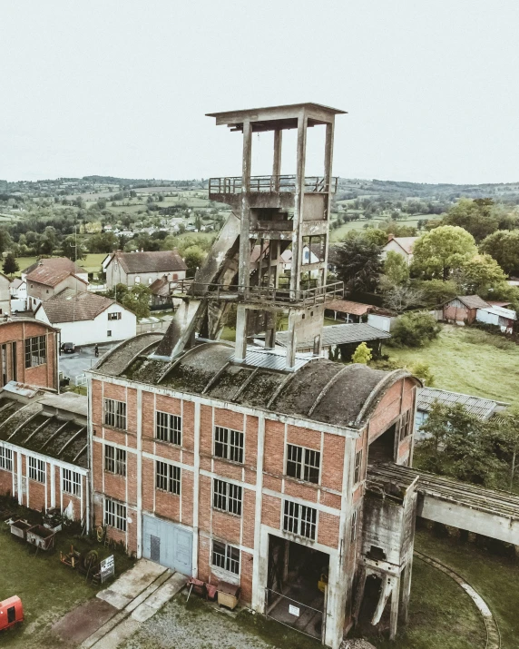 an old abandoned factory building with windows and no roof