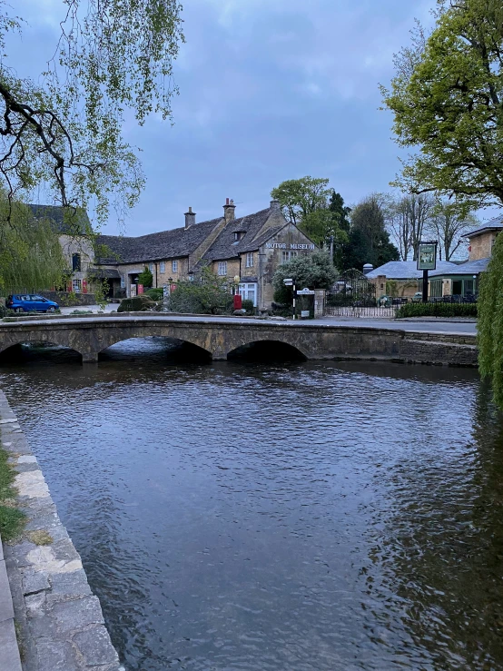 an old stone bridge over a body of water