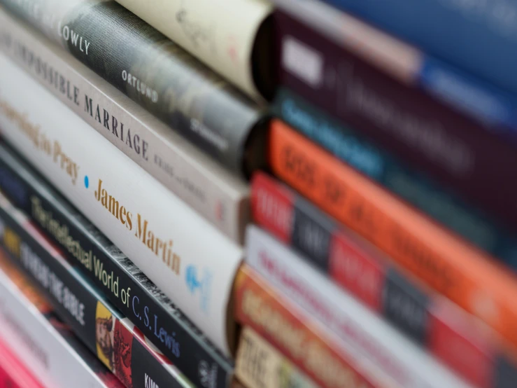 a stack of books sitting on top of a table