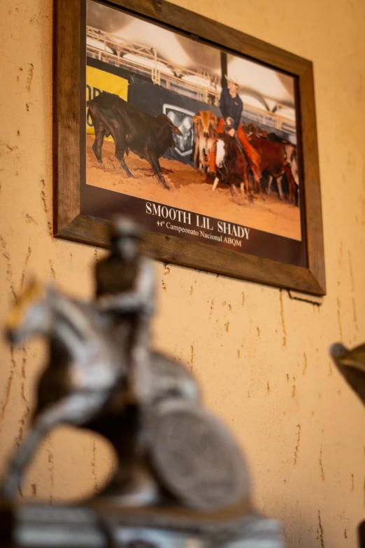 a po hanging on a wall near a cow