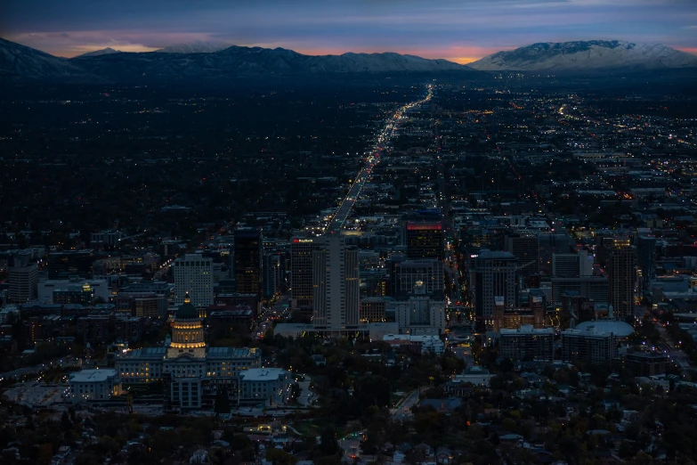 the cityscape at night, with lights and buildings