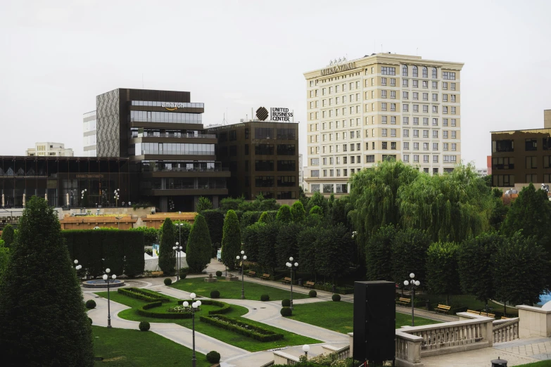 an apartment building is shown from above on top of a grassy field