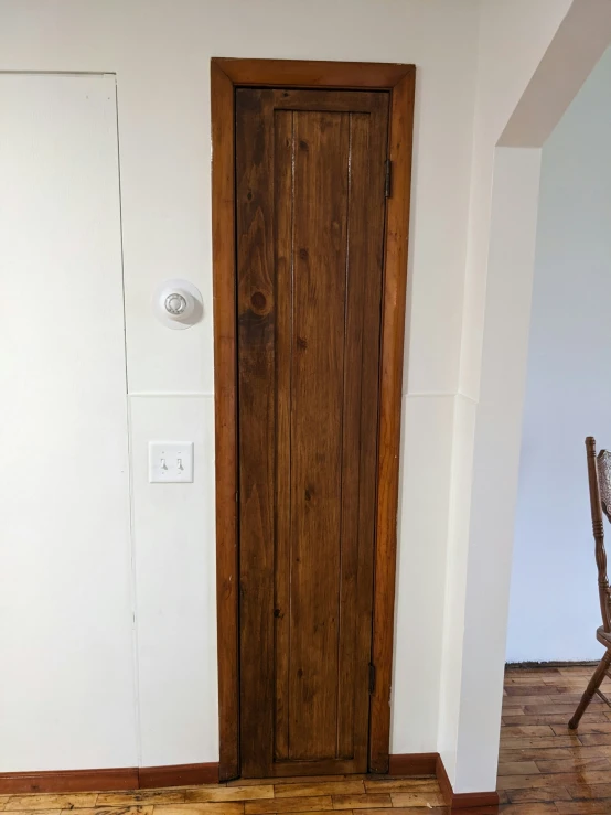 an image of a very empty room with wooden floors