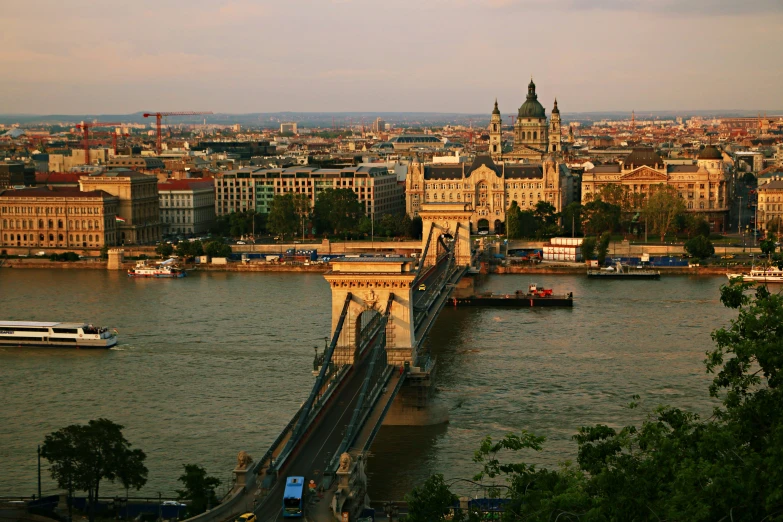 the view of the bridge that crosses over the river