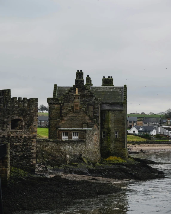 a tall castle like structure sitting in the water