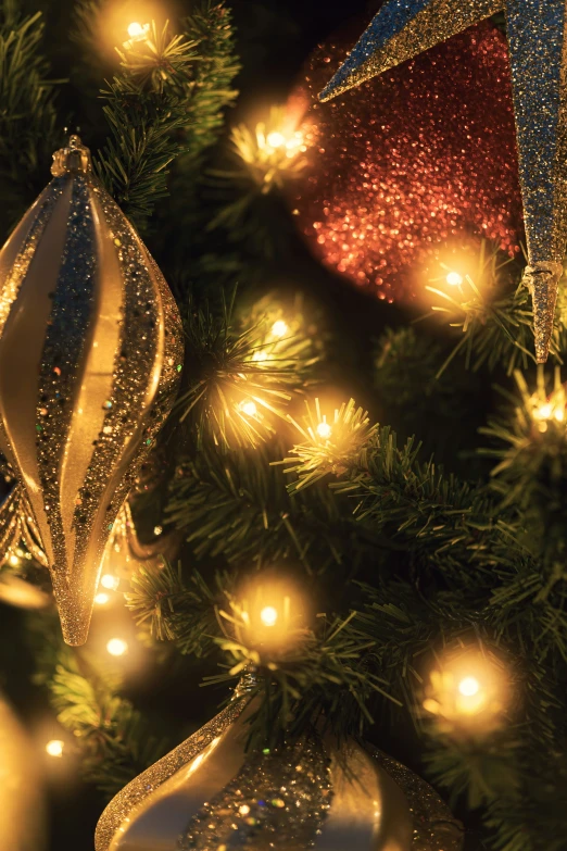 a close up of a christmas tree with lights