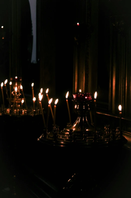the candles were lit in an alter, and many of them are lined up