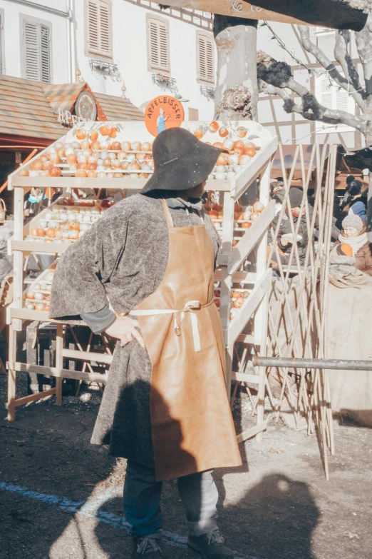 this woman is carrying an orange bag