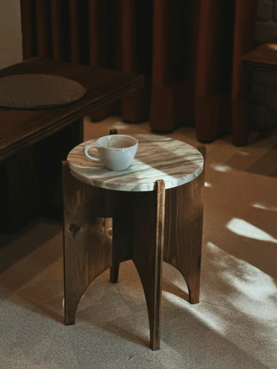 the table has a cup of coffee on it