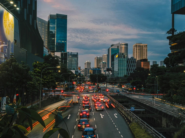 an evening scene of a city with busy traffic