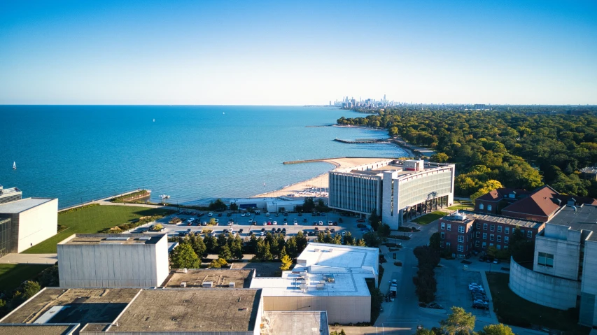 an aerial view of the waterfront and buildings along the water