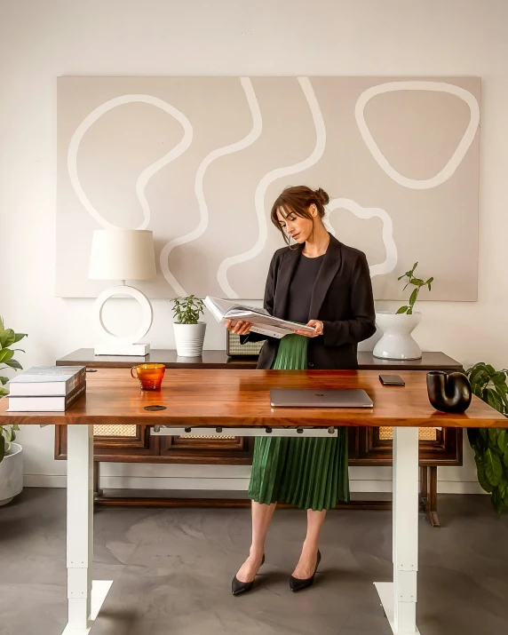 woman in a room with art and various plants