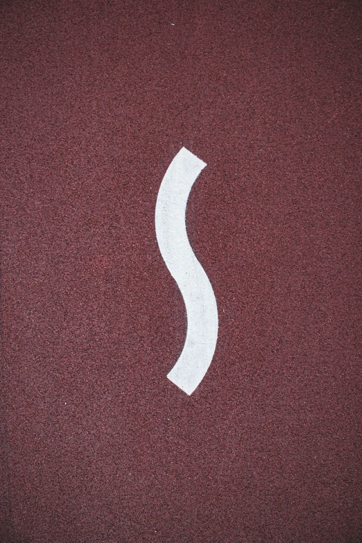 a small white curve symbol is shown on a red background