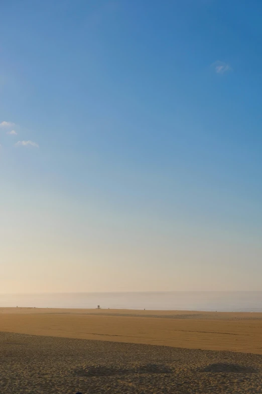 the man is riding his horse in the desert