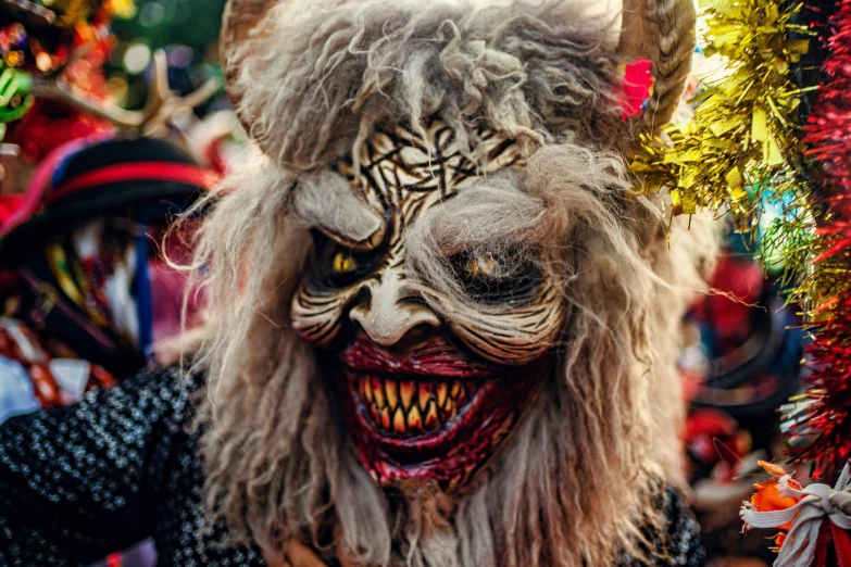 a person with elaborately decorated eyes and horns