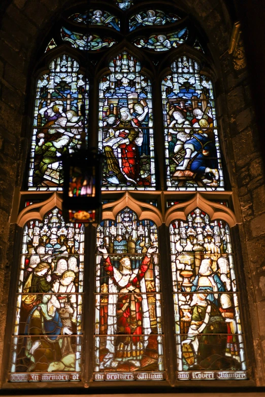 the ornate stained glass windows inside the church