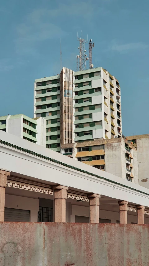 an old building with some cranes in front