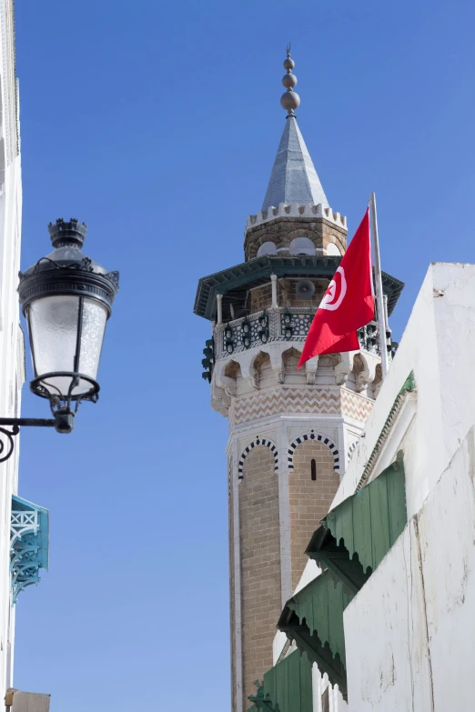 a flag on top of a building in a foreign country