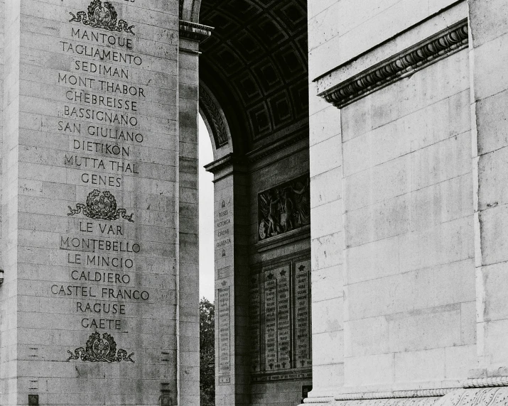 two stone pillars with carvings on each one