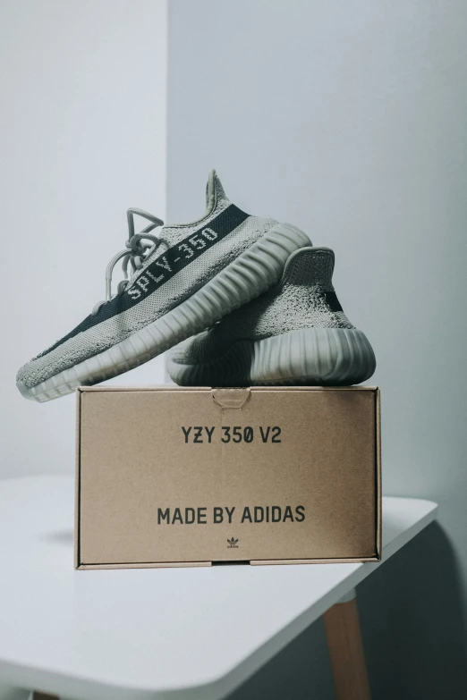 a pair of adidas sneakers are in a box