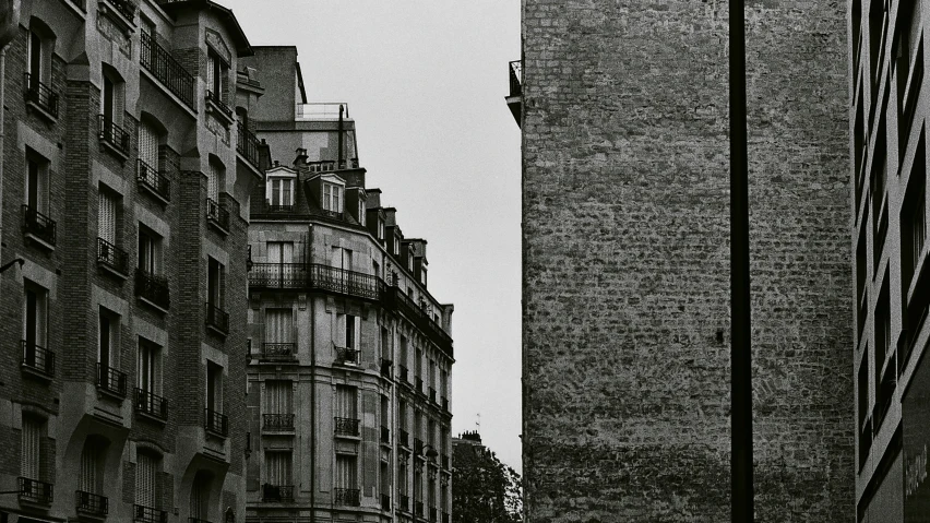 buildings against the sky are lined with balconies