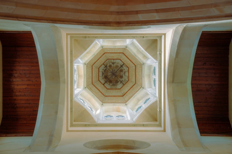 this is the ceiling in a building with a light coming from inside