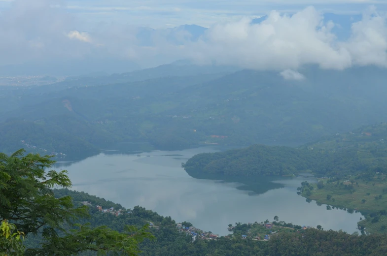 a view from a hilltop overlooking a lake